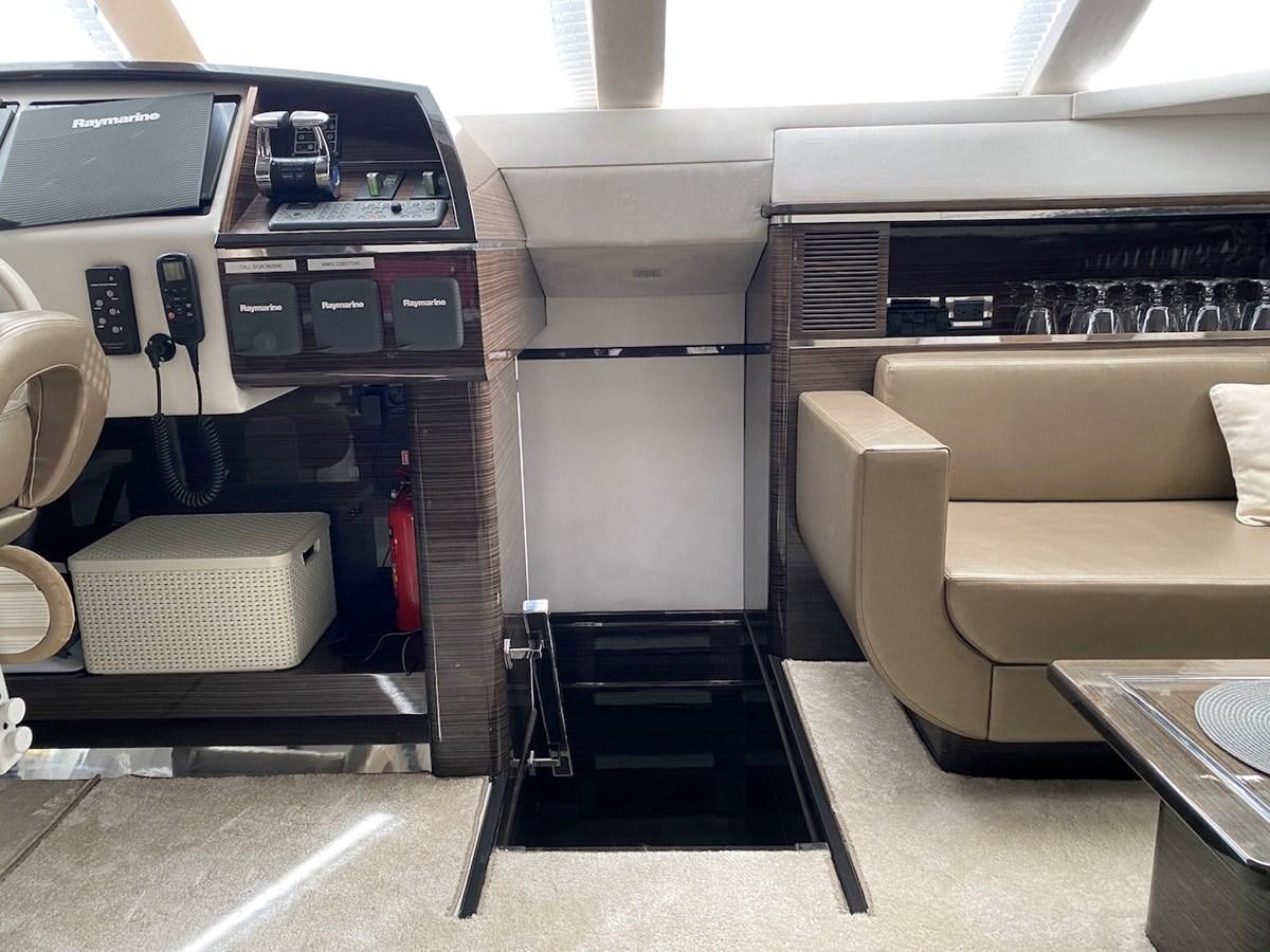 a car inside a car aboard CLOUDS Yacht for Sale