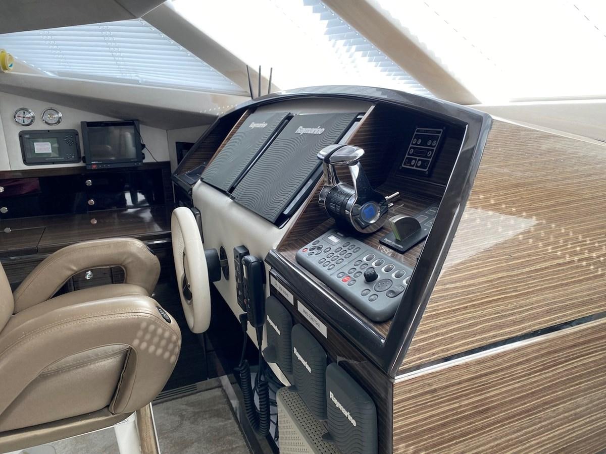 a car inside a car aboard CLOUDS Yacht for Sale