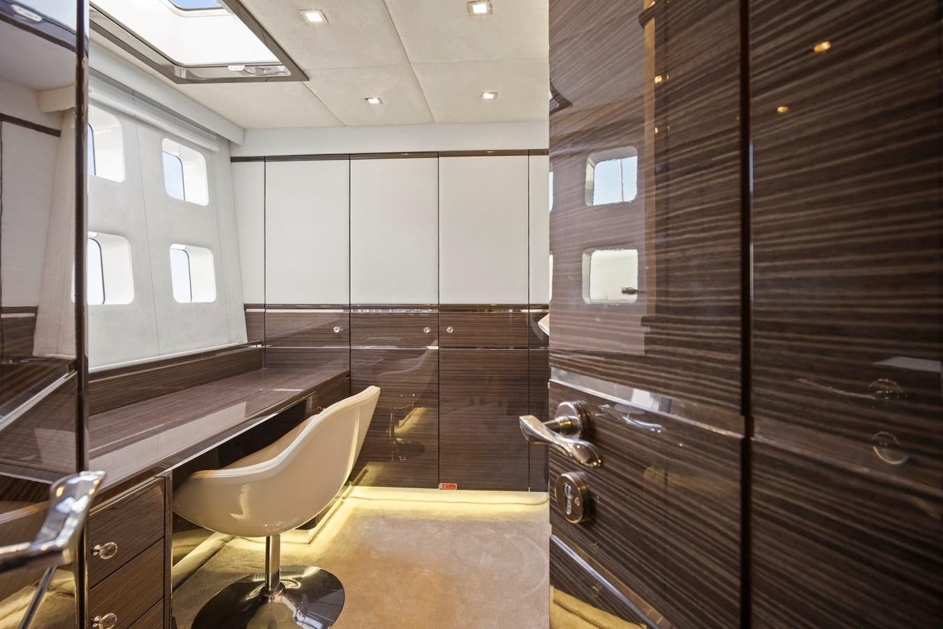 a room with a large cabinet aboard CLOUDS Yacht for Sale