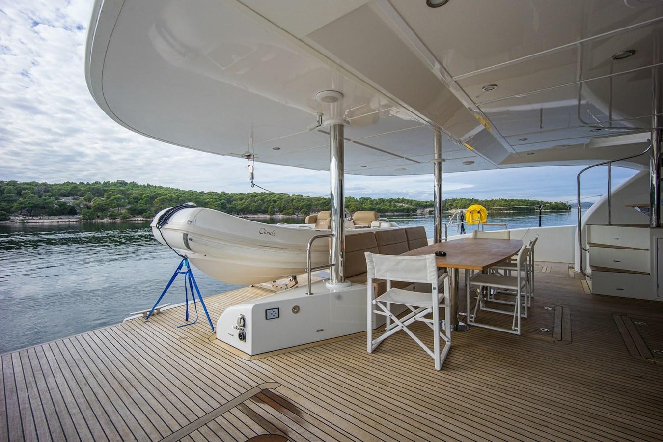 a boat on a deck aboard CLOUDS Yacht for Sale