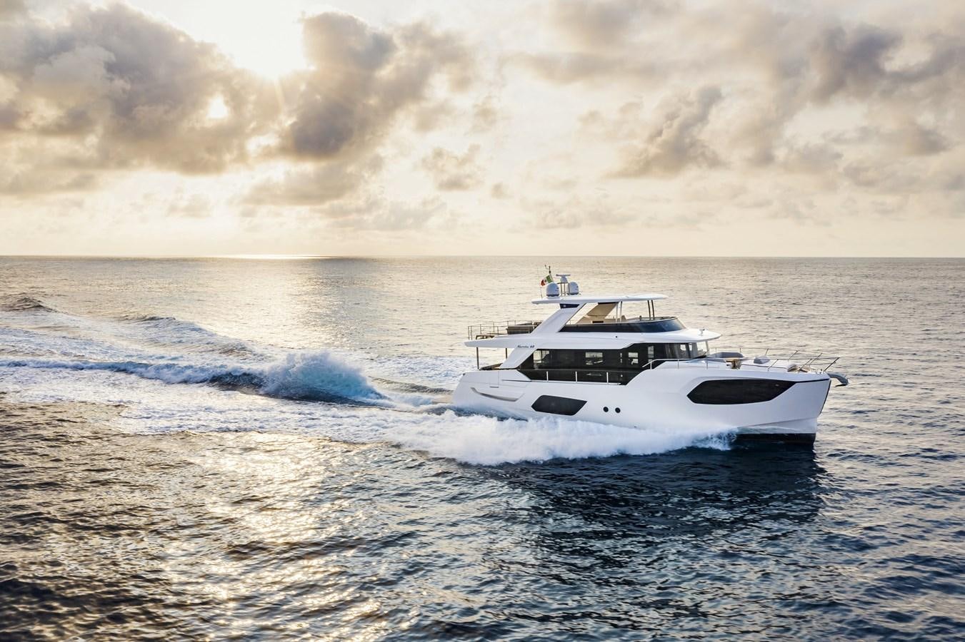a white boat on the water aboard 2025 ABSOLUTE NAVERTTA 68 Yacht for Sale