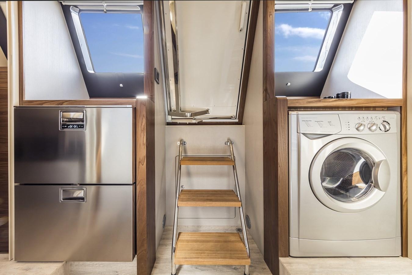 a ladder next to a refrigerator aboard 2025 ABSOLUTE NAVERTTA 68 Yacht for Sale