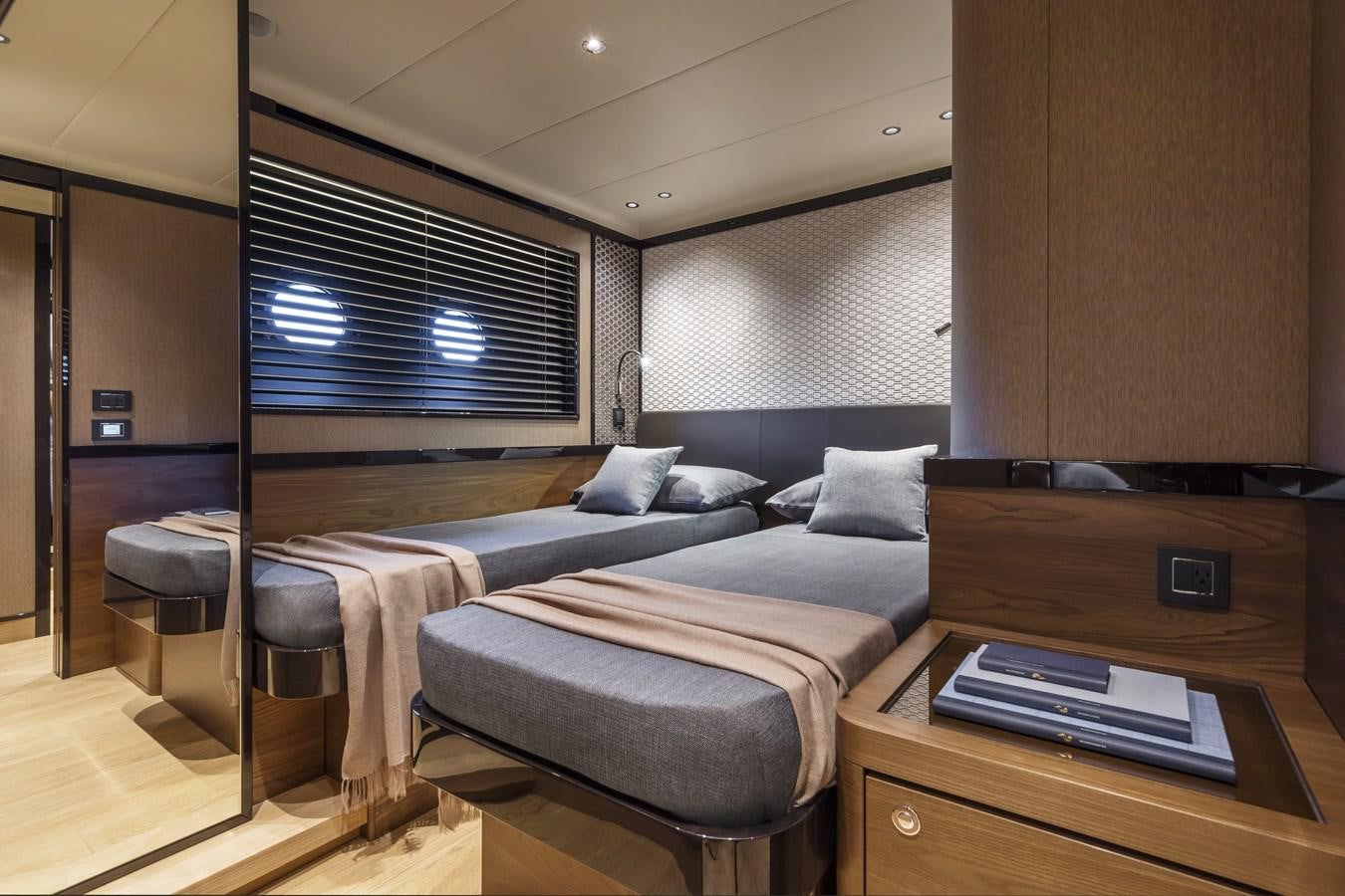 a bedroom with a bed and desk aboard 2025 ABSOLUTE NAVERTTA 68 Yacht for Sale