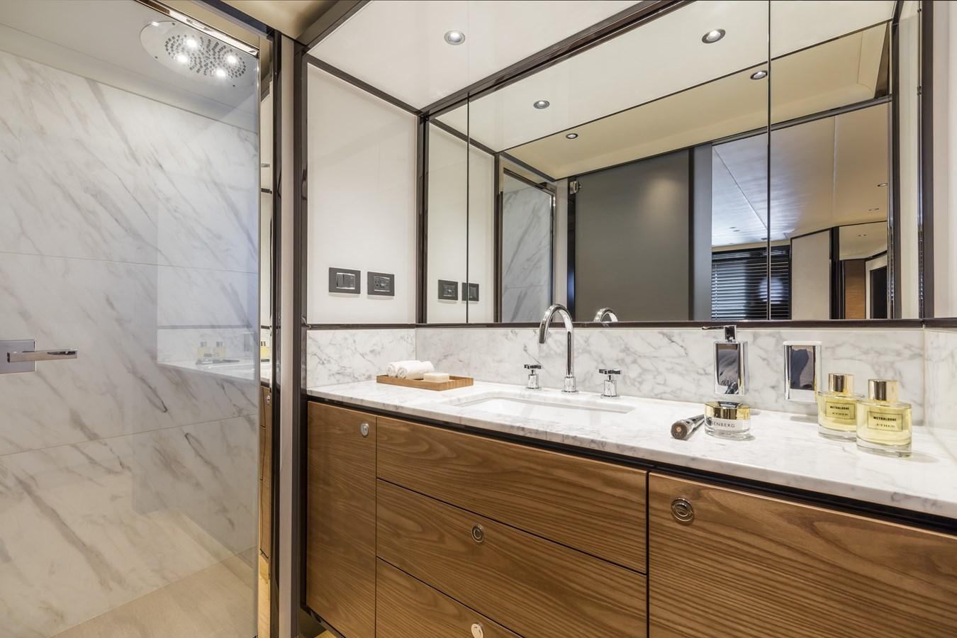 a bathroom with a large mirror aboard 2025 ABSOLUTE NAVERTTA 68 Yacht for Sale
