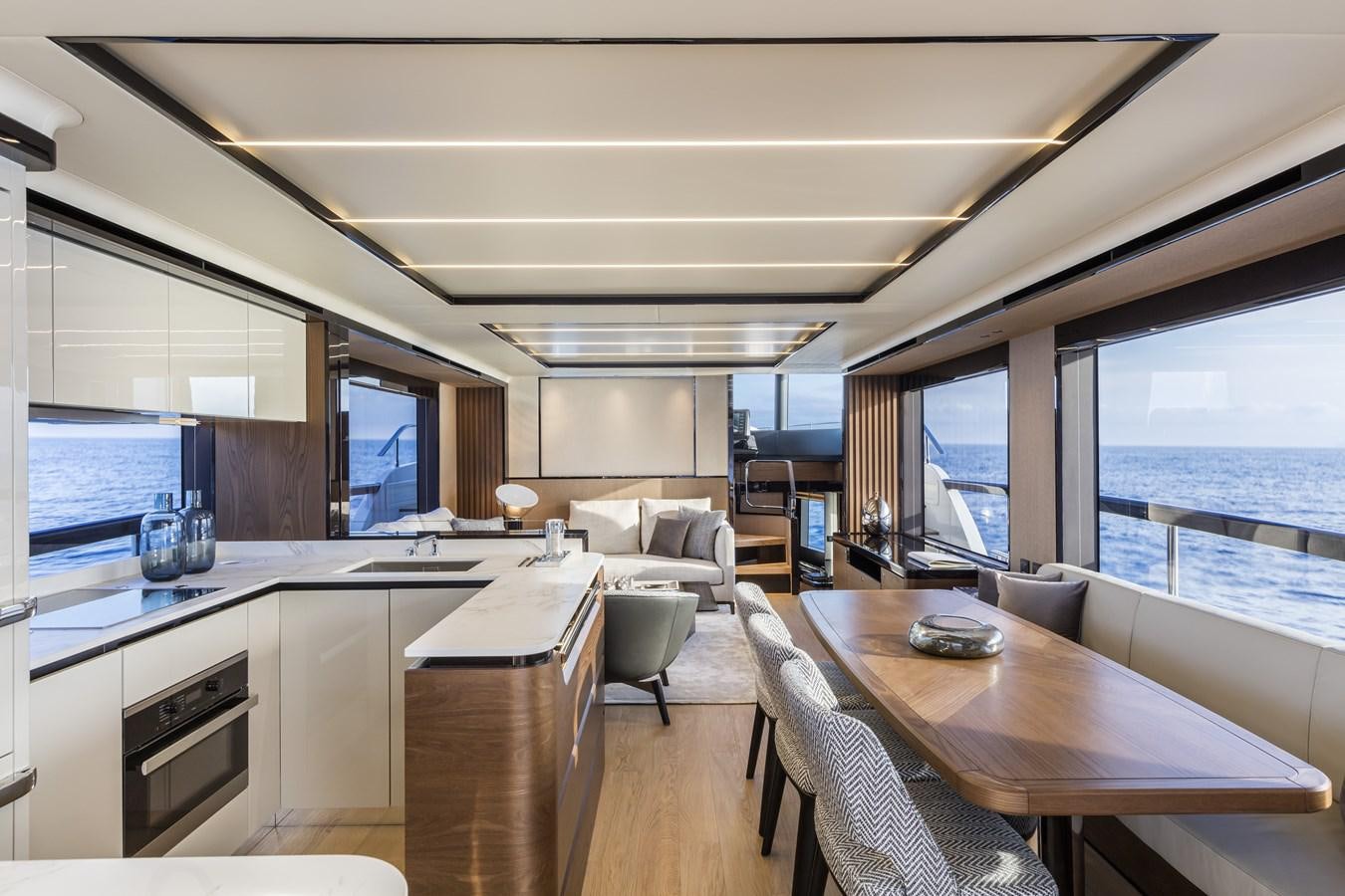 a modern looking kitchen with a large window aboard 2025 ABSOLUTE NAVERTTA 68 Yacht for Sale