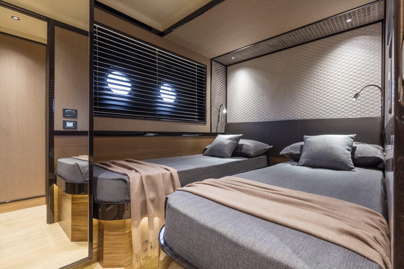 a room with a bed and a window aboard 2025 ABSOLUTE NAVERTTA 68 Yacht for Sale