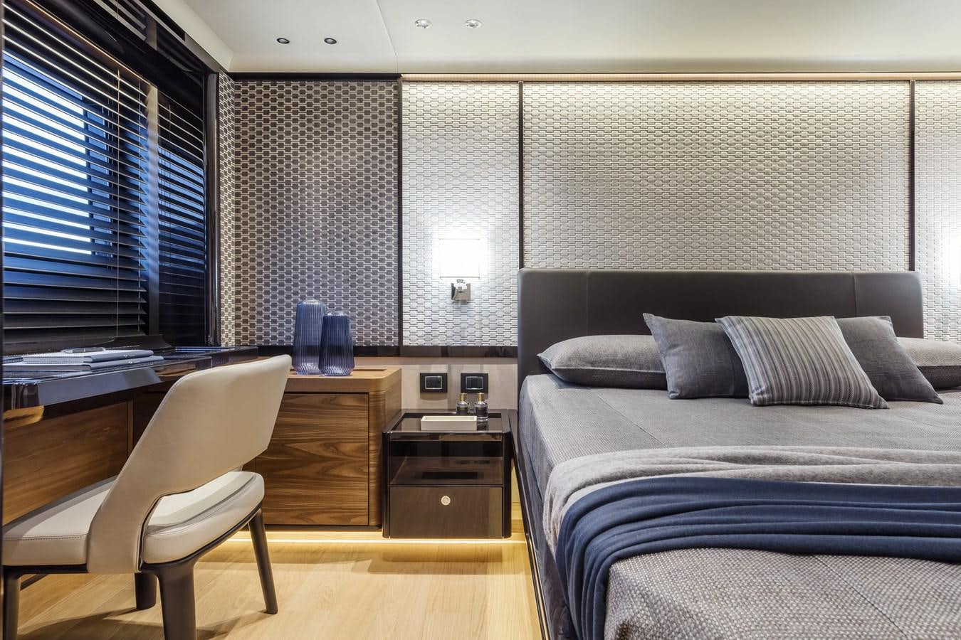 a room with a bed and a desk aboard 2025 ABSOLUTE NAVERTTA 68 Yacht for Sale