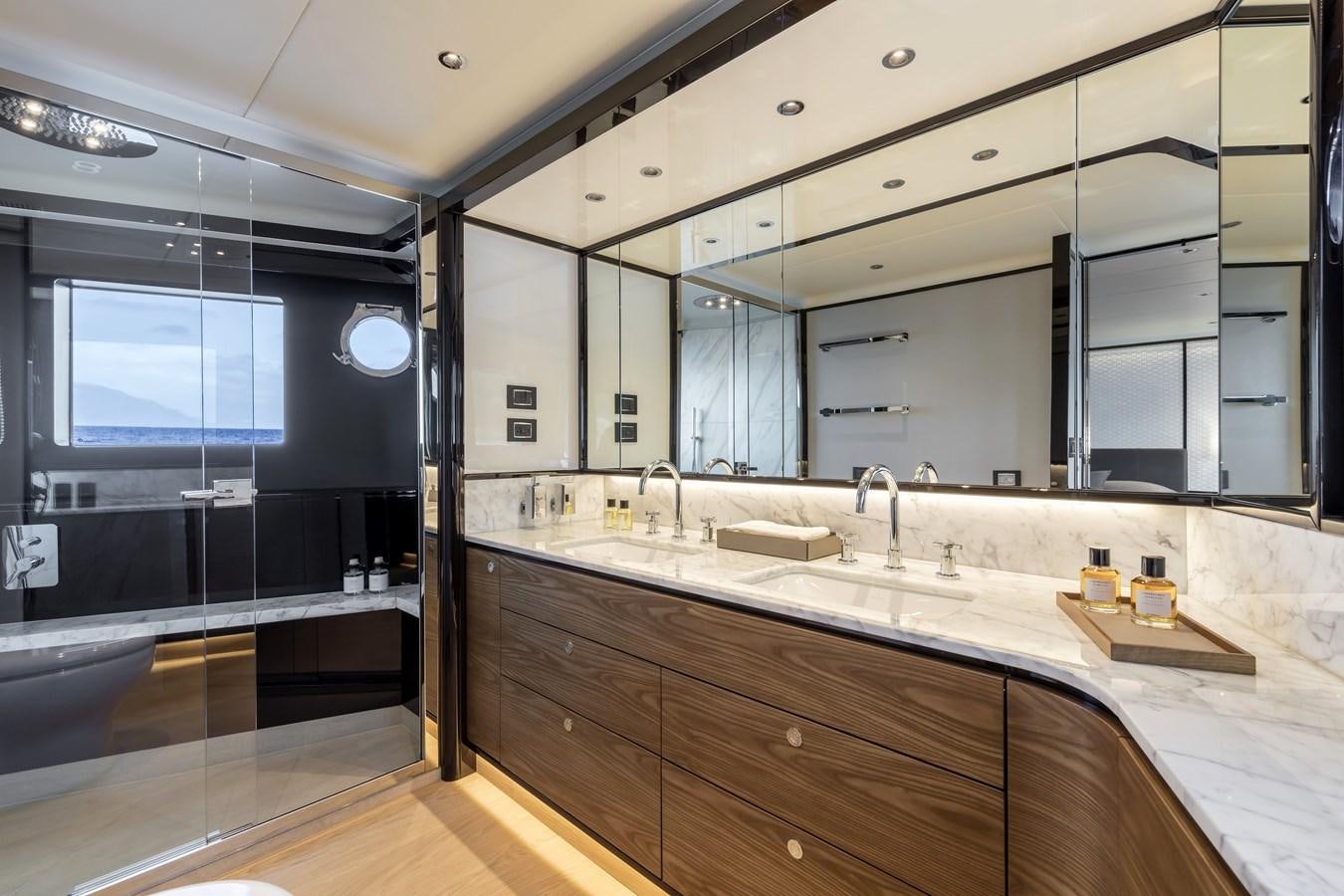 a bathroom with a large mirror aboard 2025 ABSOLUTE NAVERTTA 68 Yacht for Sale