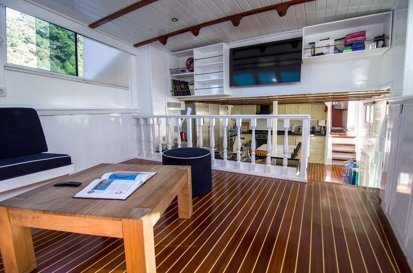 a room with a table and chairs aboard HARRY HALLER Yacht for Sale