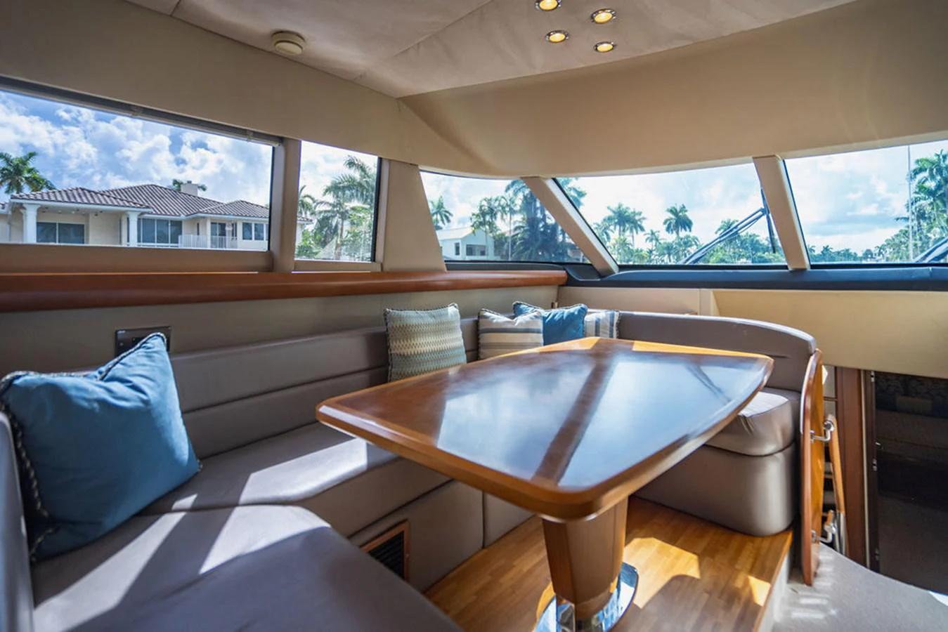 a table and chairs in a room aboard EMPIRE SUN Yacht for Sale