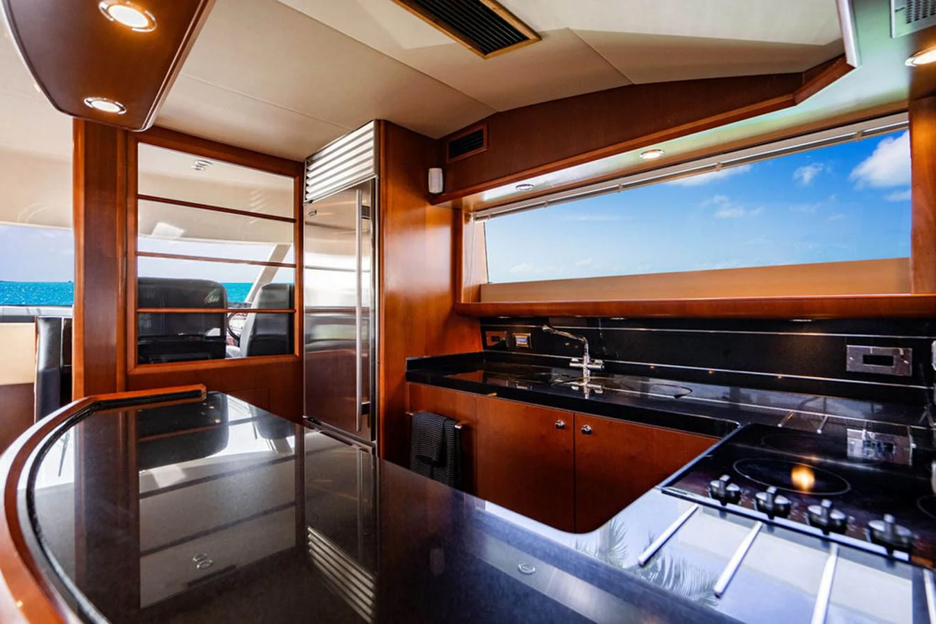a kitchen with a glass wall aboard EMPIRE SUN Yacht for Sale