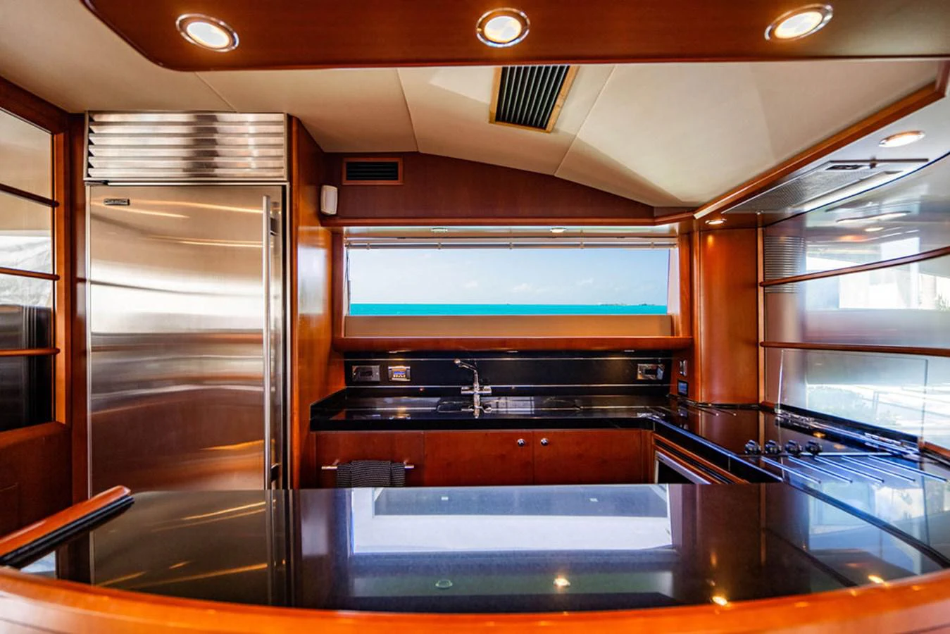 a kitchen with a glass door aboard EMPIRE SUN Yacht for Sale