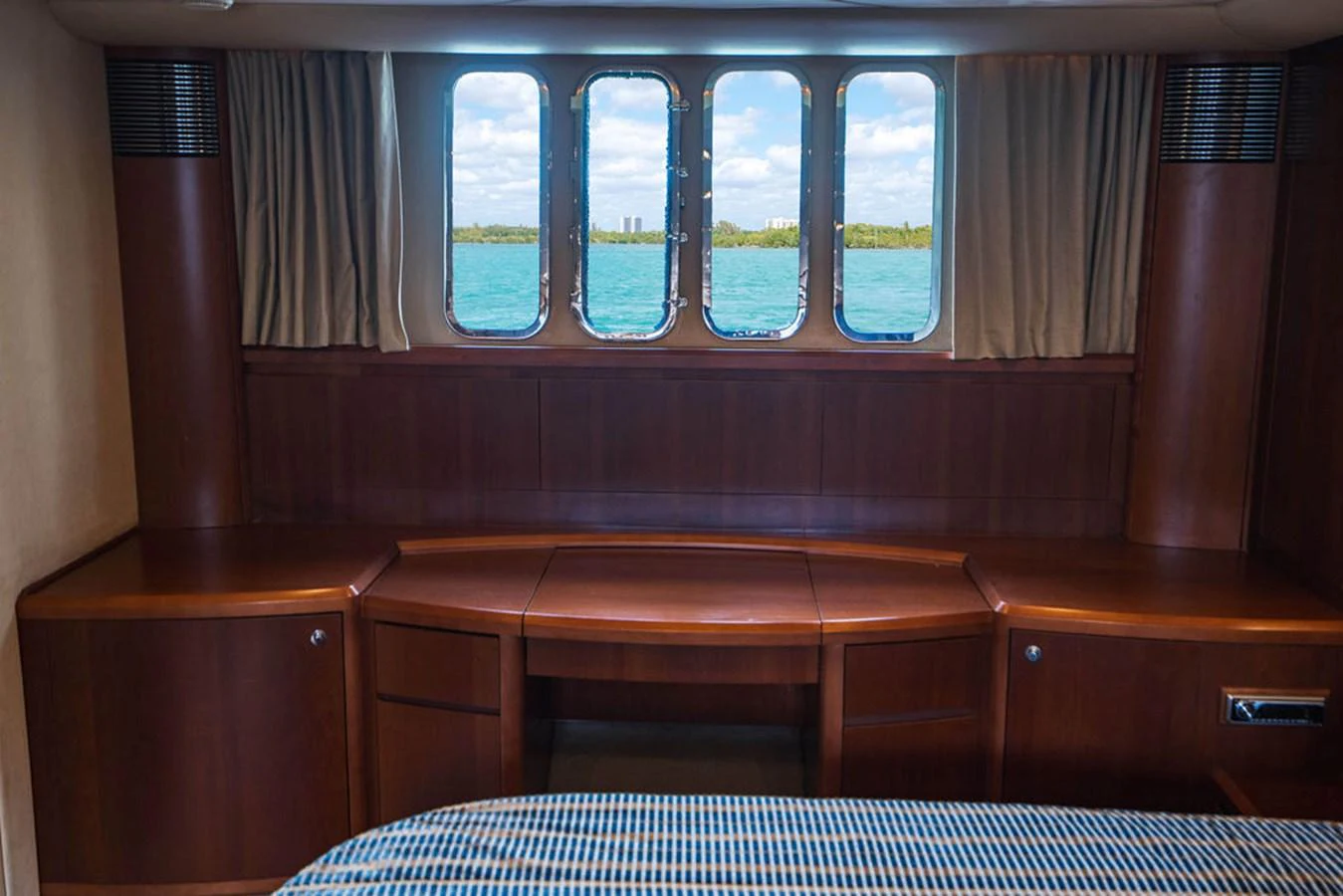 a room with a bed and a window aboard EMPIRE SUN Yacht for Sale