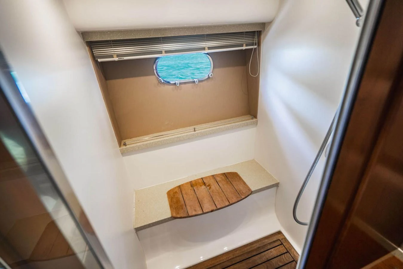 a white and brown bathroom aboard EMPIRE SUN Yacht for Sale