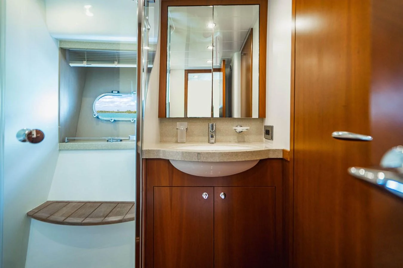 a bathroom with a sink and a mirror aboard EMPIRE SUN Yacht for Sale