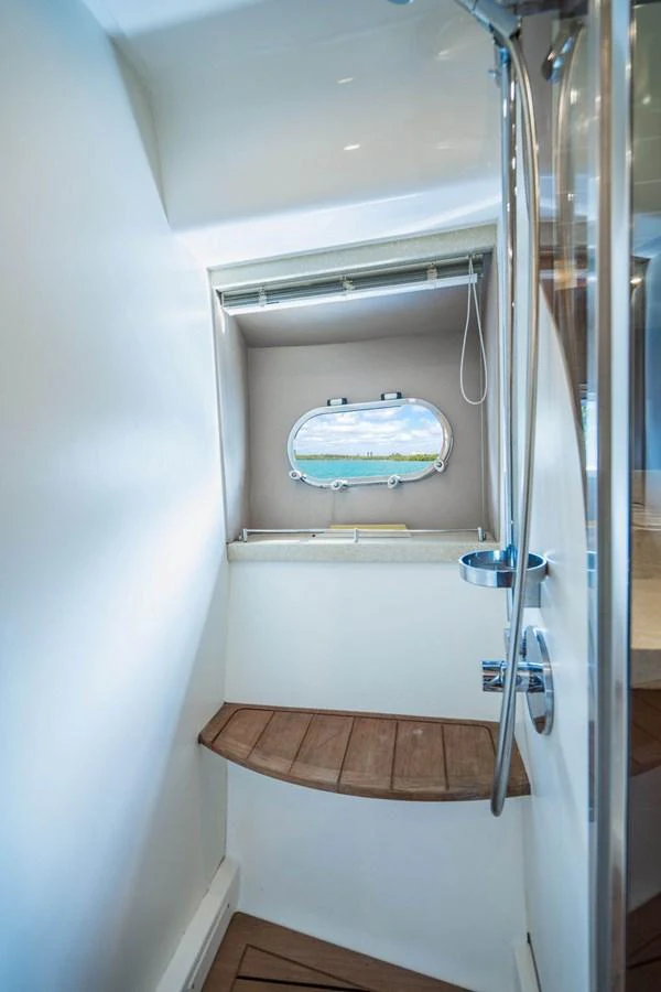 a shower with a glass door aboard EMPIRE SUN Yacht for Sale