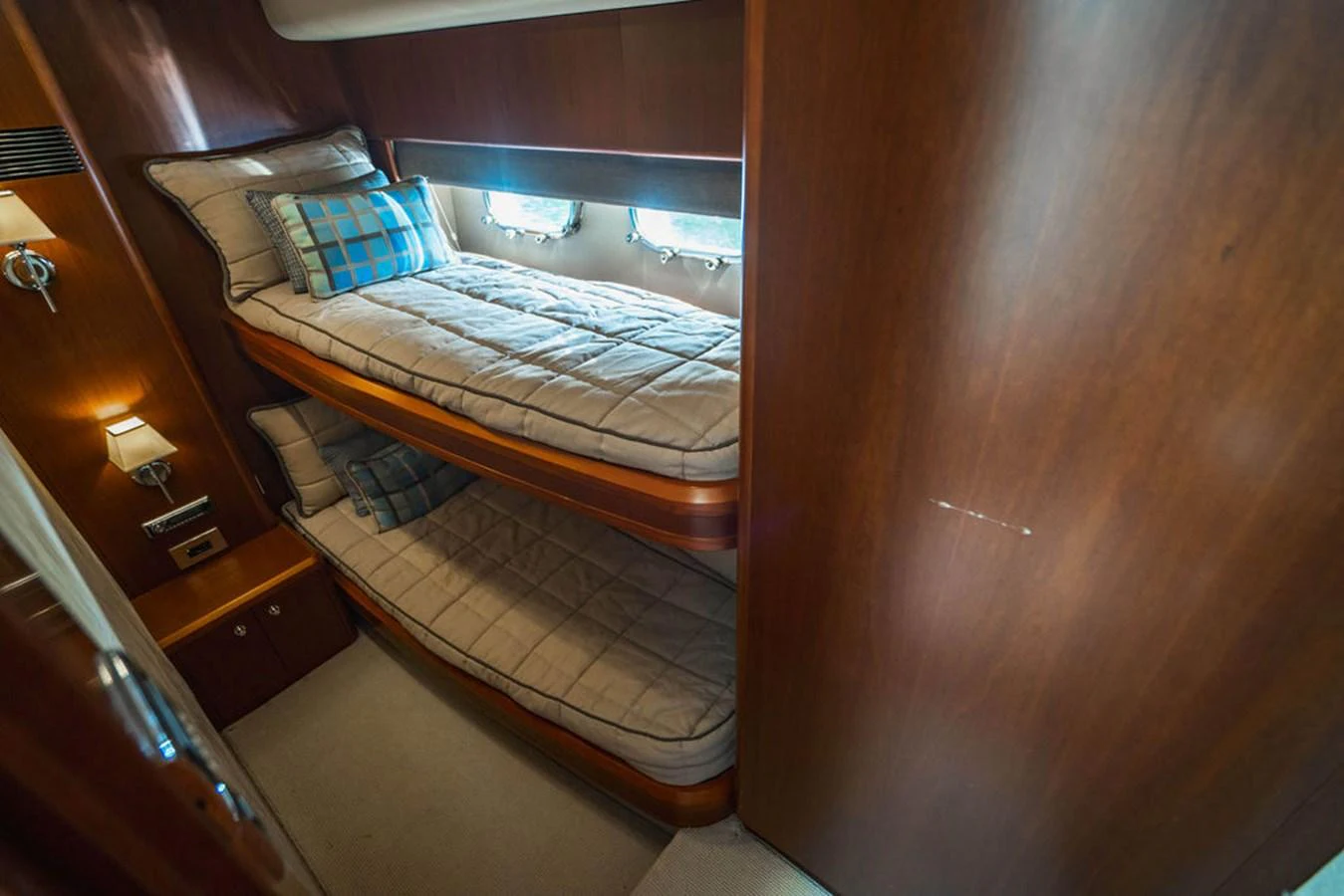 a bed in a room aboard EMPIRE SUN Yacht for Sale