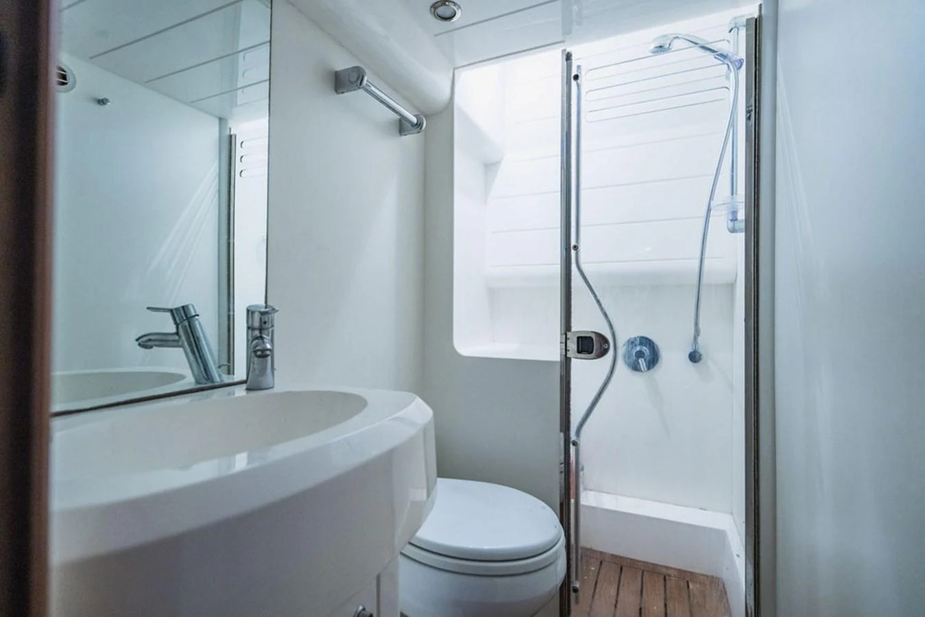 a bathroom with a shower and toilet aboard EMPIRE SUN Yacht for Sale