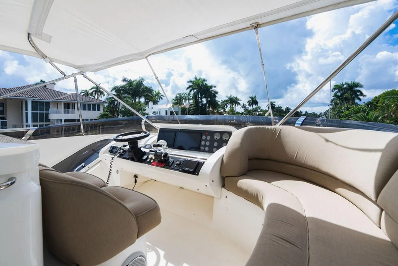 a white tent with a white roof and a white sofa and a white car with trees and blue aboard EMPIRE SUN Yacht for Sale