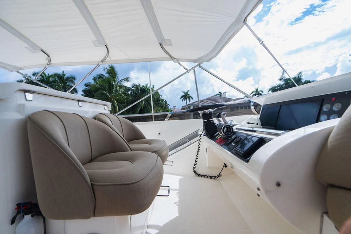 a car with a screen and a keyboard on the dashboard aboard EMPIRE SUN Yacht for Sale