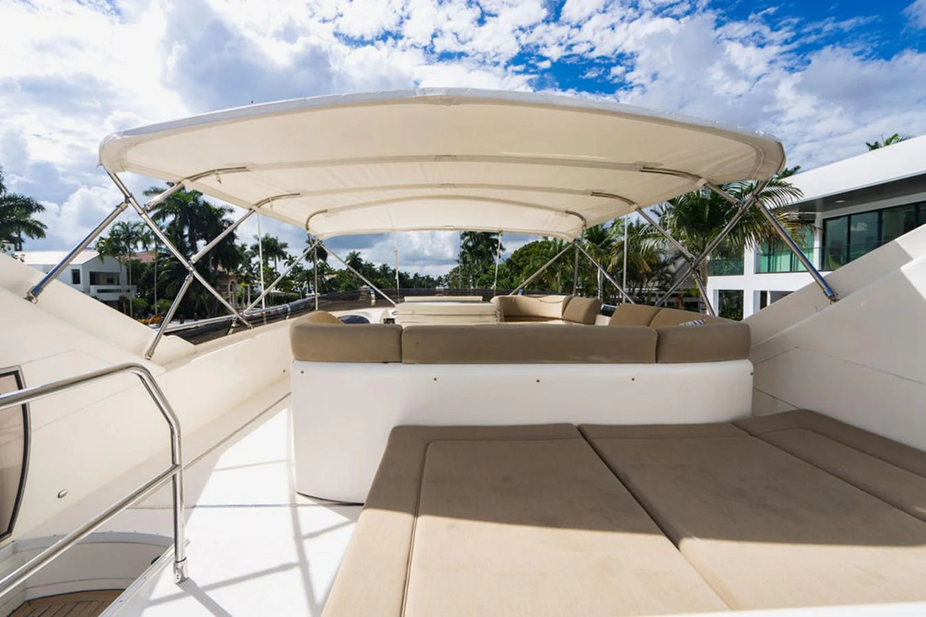a white lounge chair outside a building aboard EMPIRE SUN Yacht for Sale