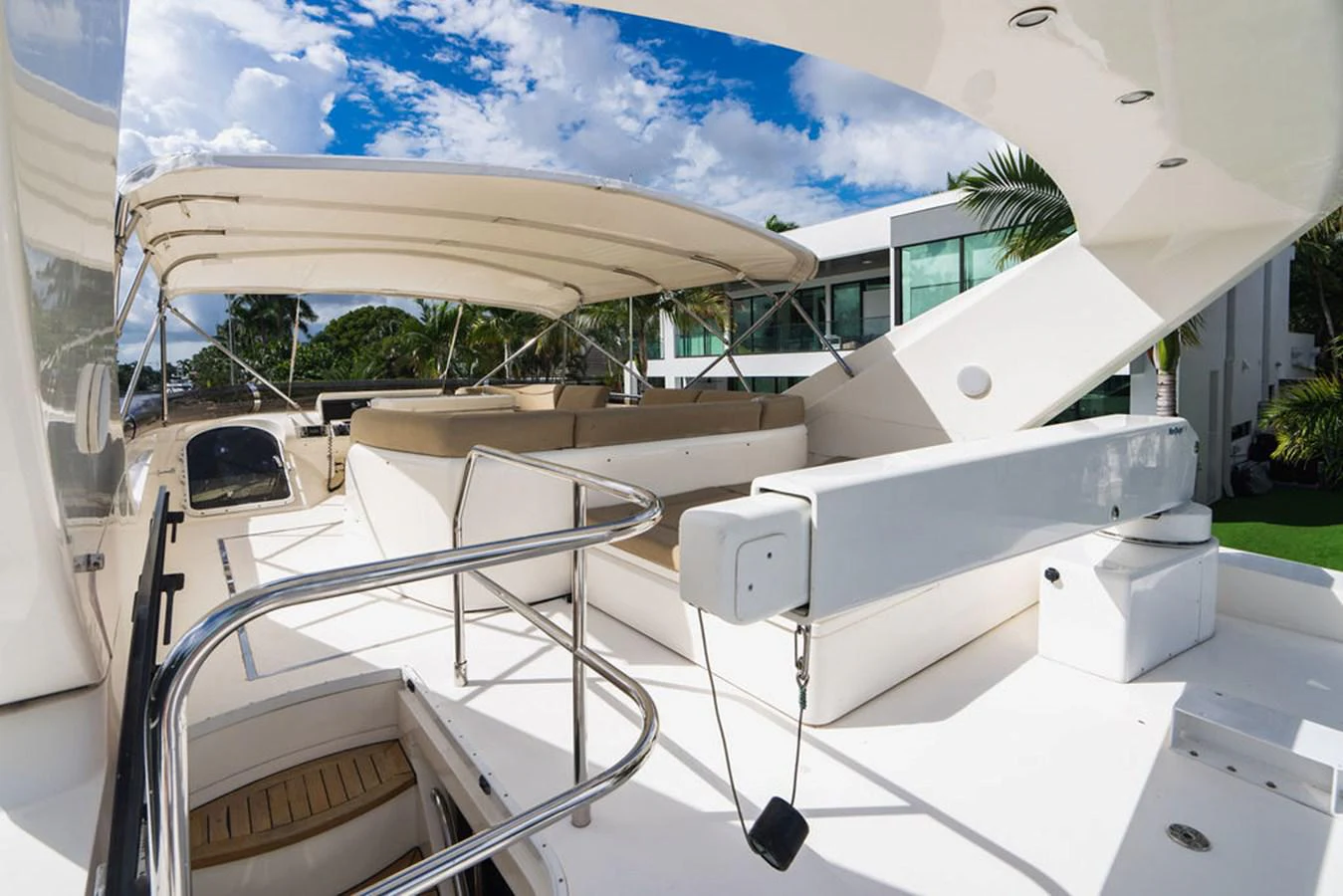 a white building with a large white umbrella aboard EMPIRE SUN Yacht for Sale