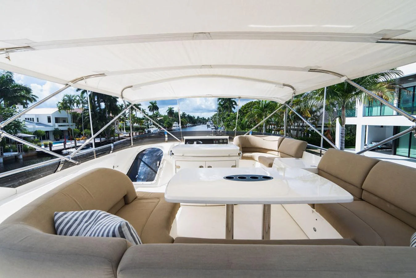 a large white tent with a table and couches aboard EMPIRE SUN Yacht for Sale