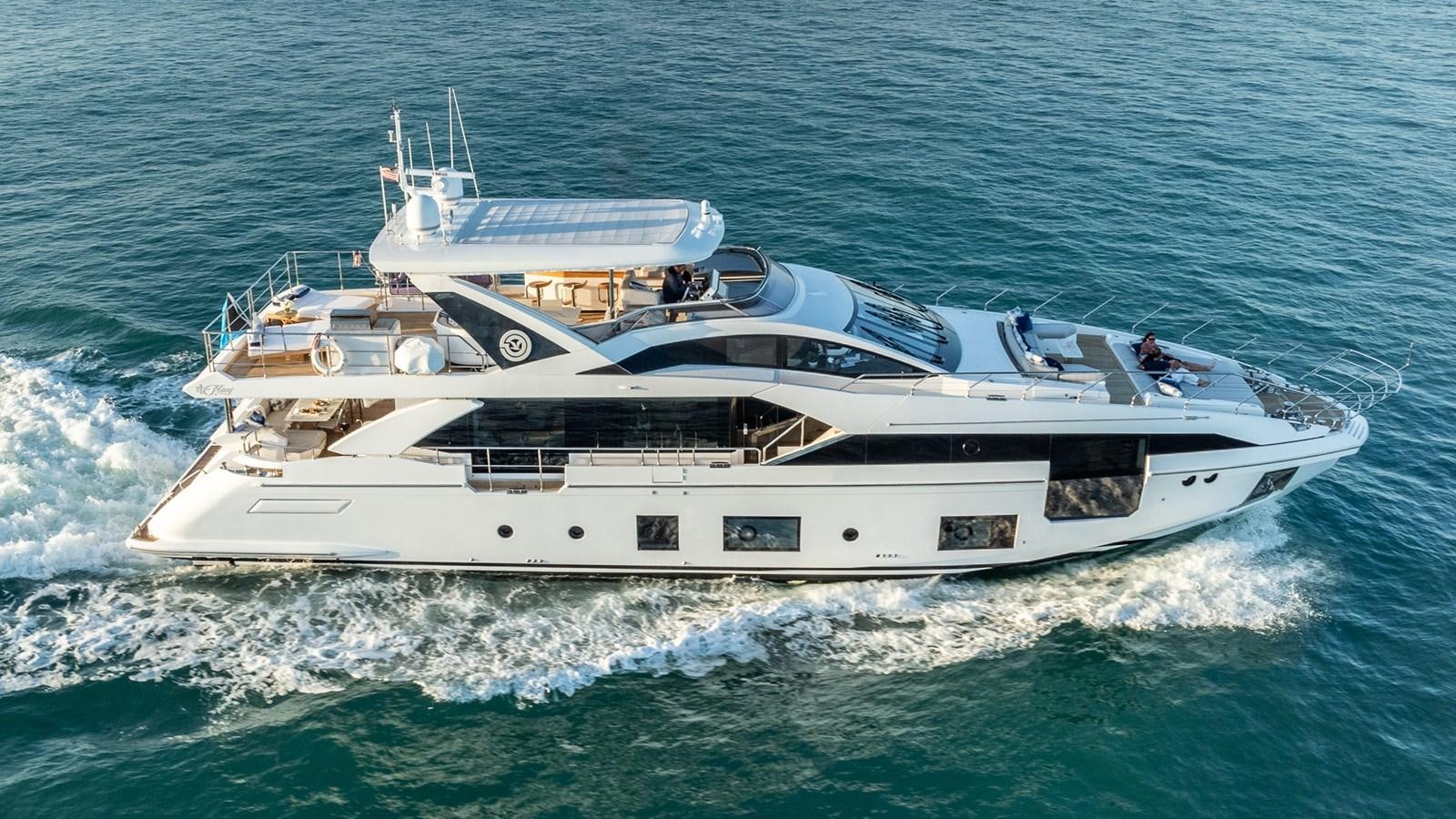 a white yacht on the water aboard 4 PLAY Yacht for Sale