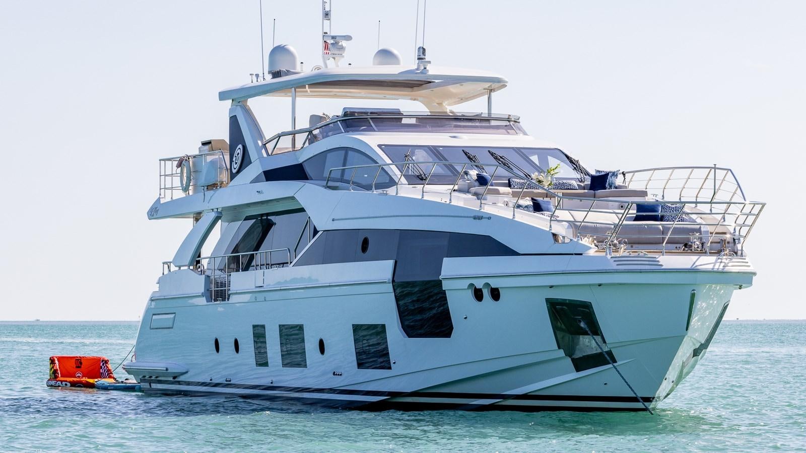 a white yacht in the water aboard 4 PLAY Yacht for Sale