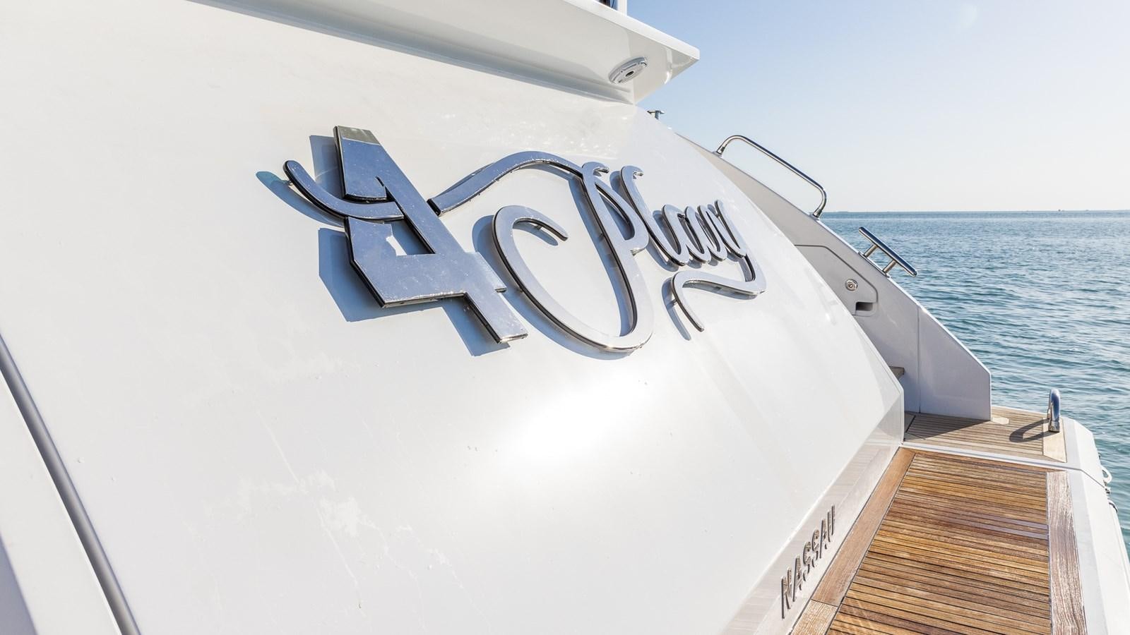 a boat with a sign on the front aboard 4 PLAY Yacht for Sale