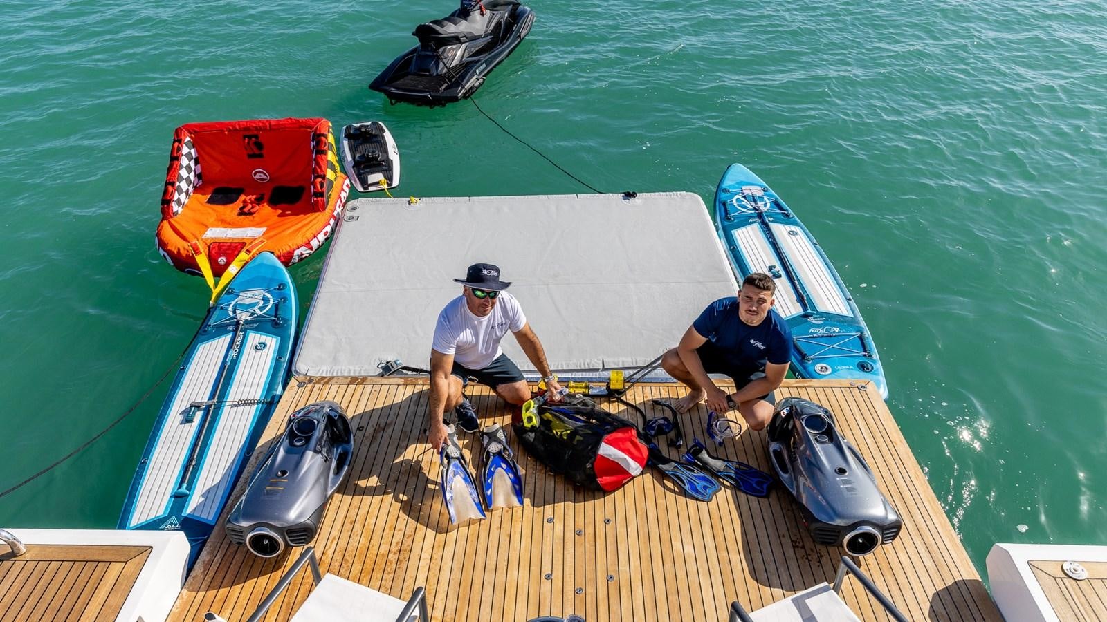 a couple of men on a boat aboard 4 PLAY Yacht for Sale