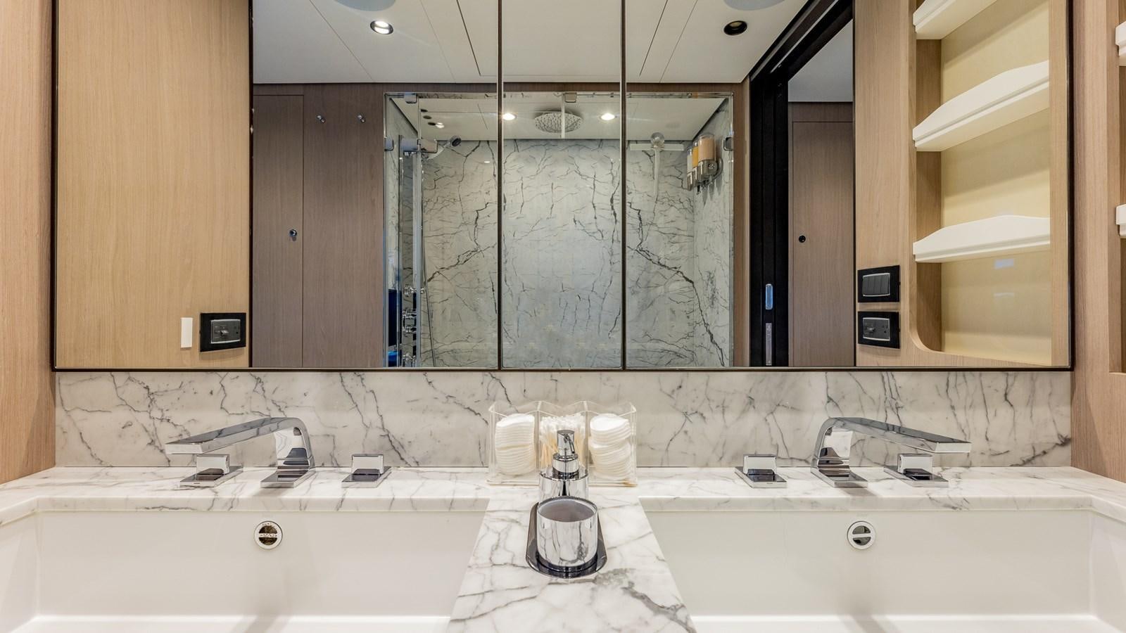 a bathroom with a large mirror aboard 4 PLAY Yacht for Sale