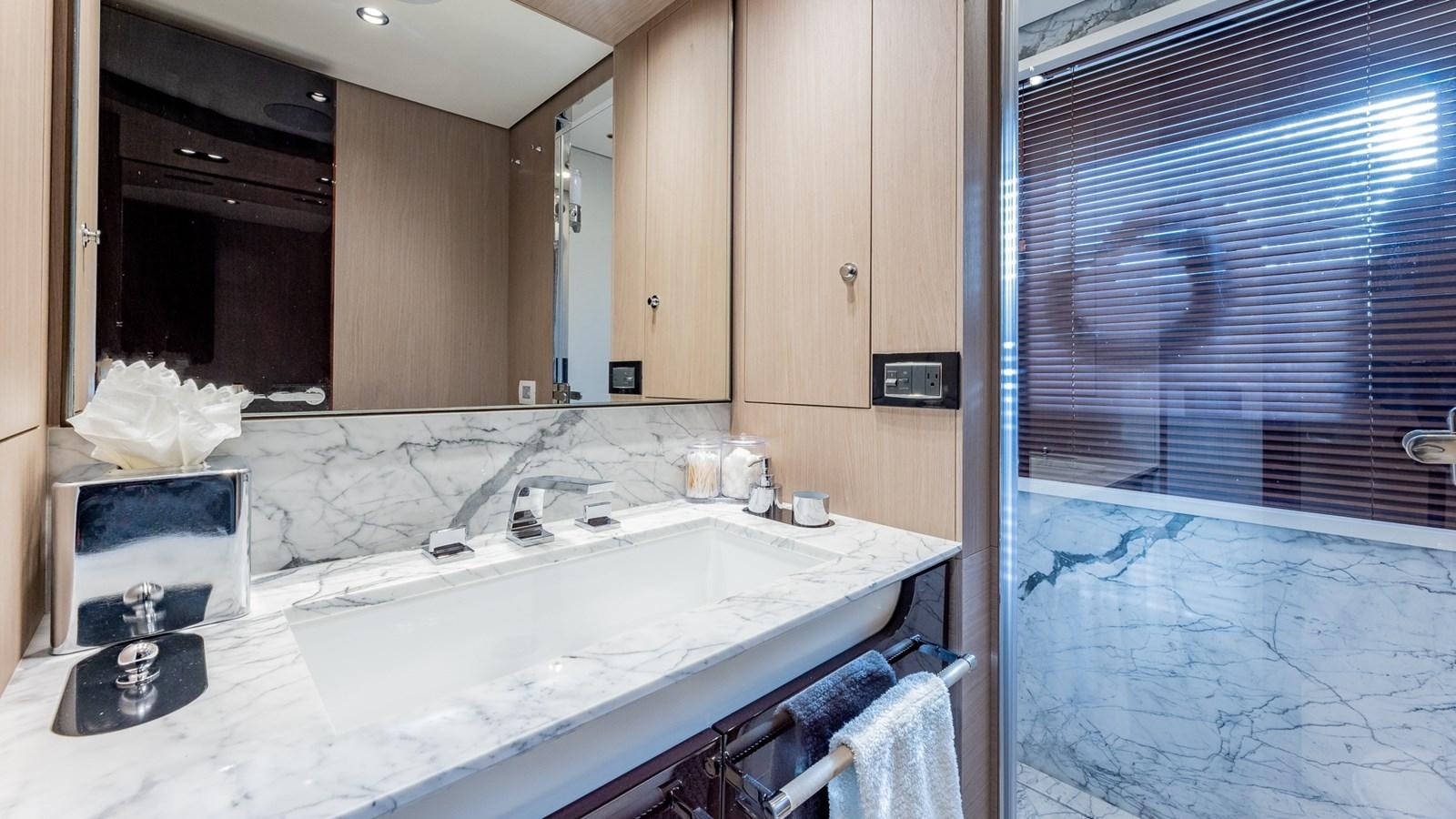 a bathroom with a sink and a mirror aboard 4 PLAY Yacht for Sale