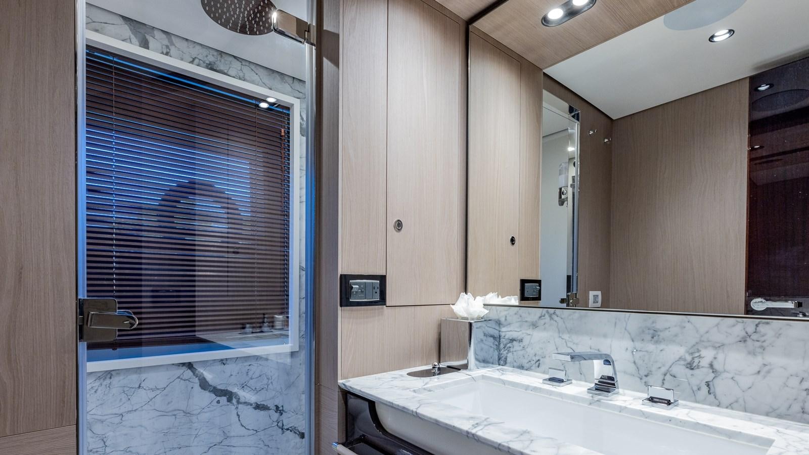 a bathroom with a large mirror aboard 4 PLAY Yacht for Sale