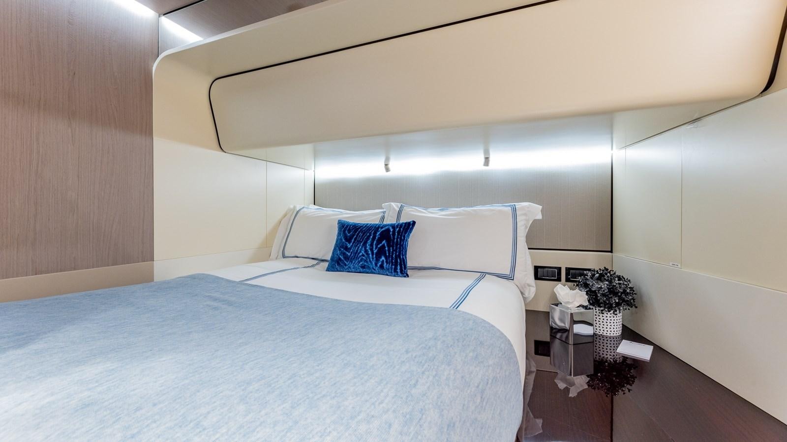 a bed with white sheets aboard 4 PLAY Yacht for Sale