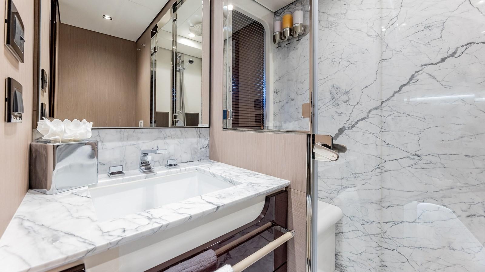a bathroom with a large mirror aboard 4 PLAY Yacht for Sale