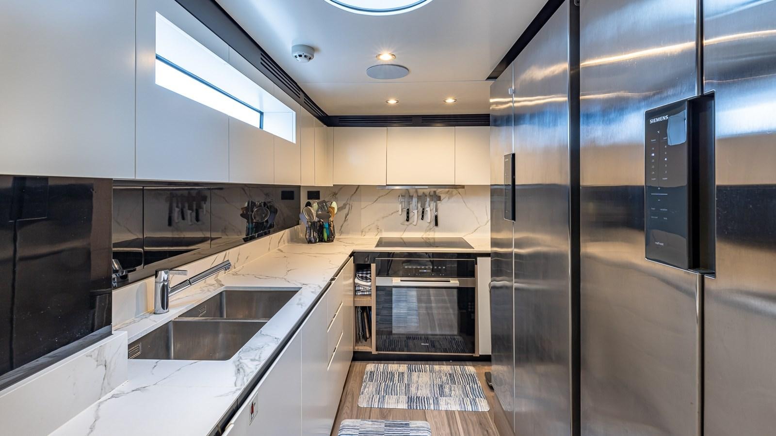 a kitchen with a large glass shower aboard 4 PLAY Yacht for Sale