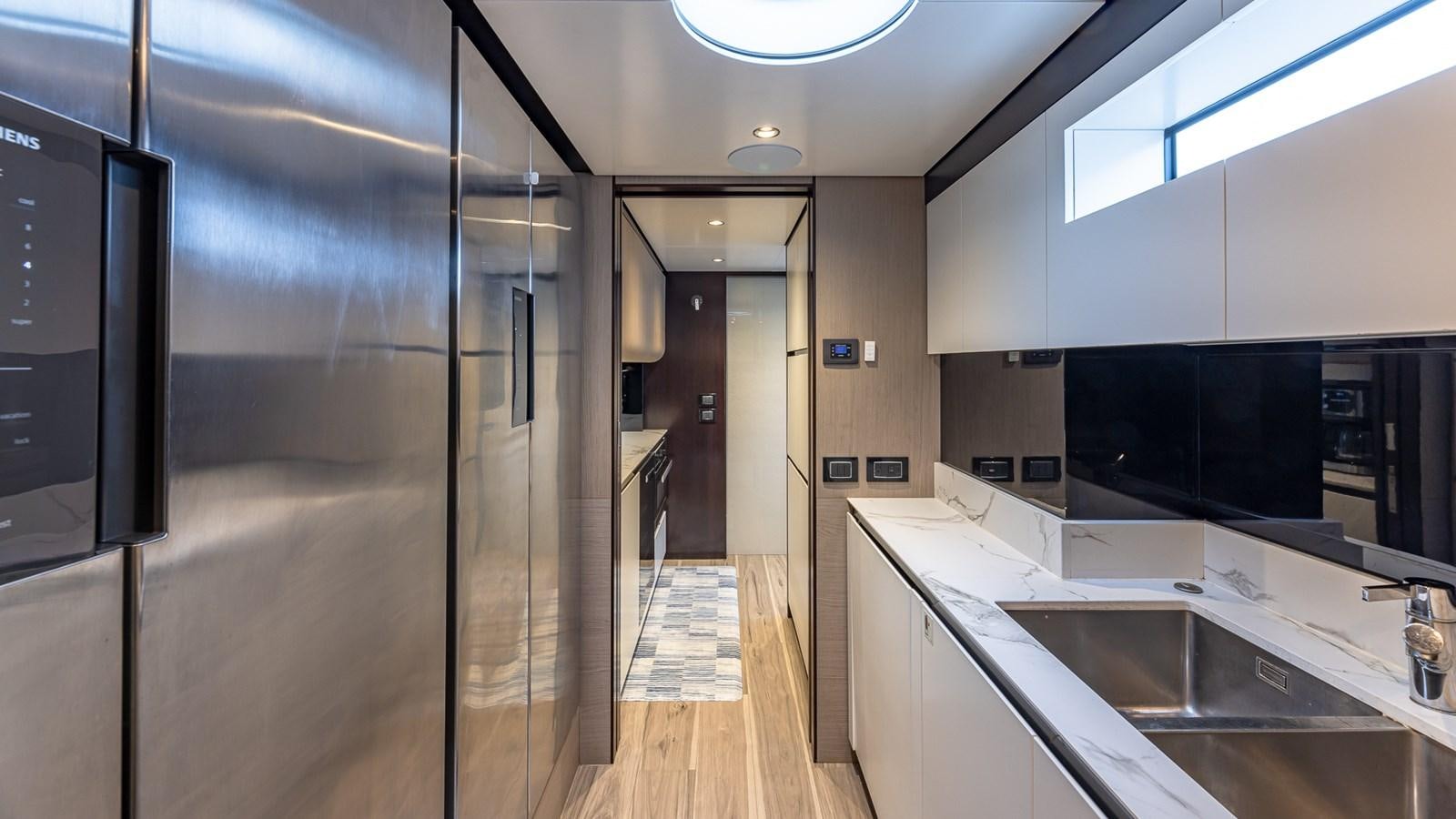 a kitchen with a large countertop aboard 4 PLAY Yacht for Sale