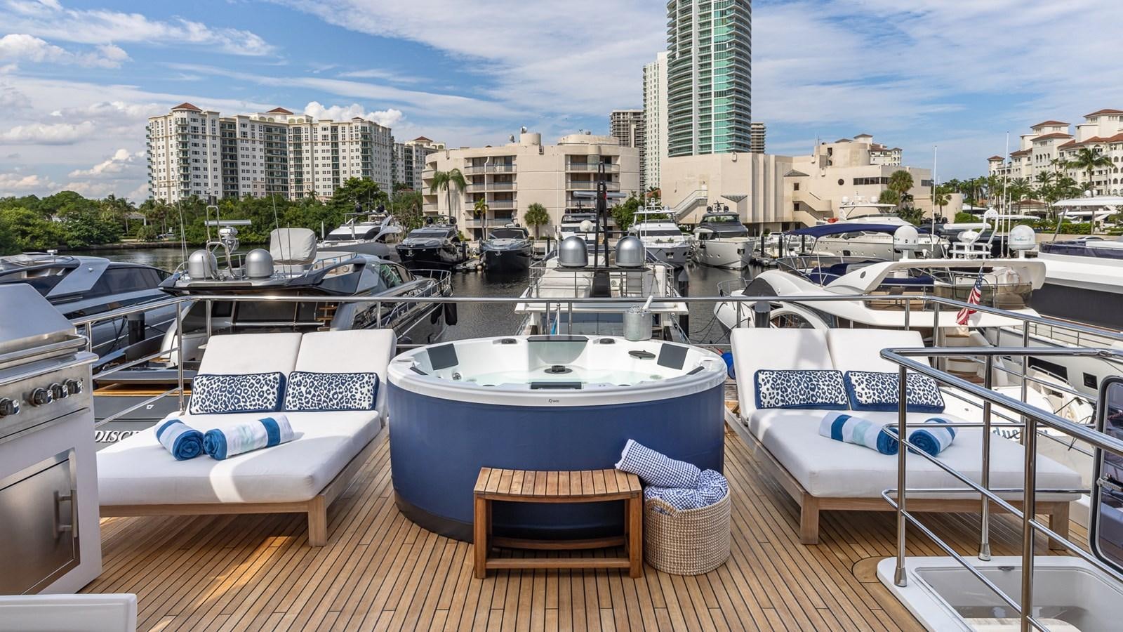a boat dock with lounge chairs aboard 4 PLAY Yacht for Sale