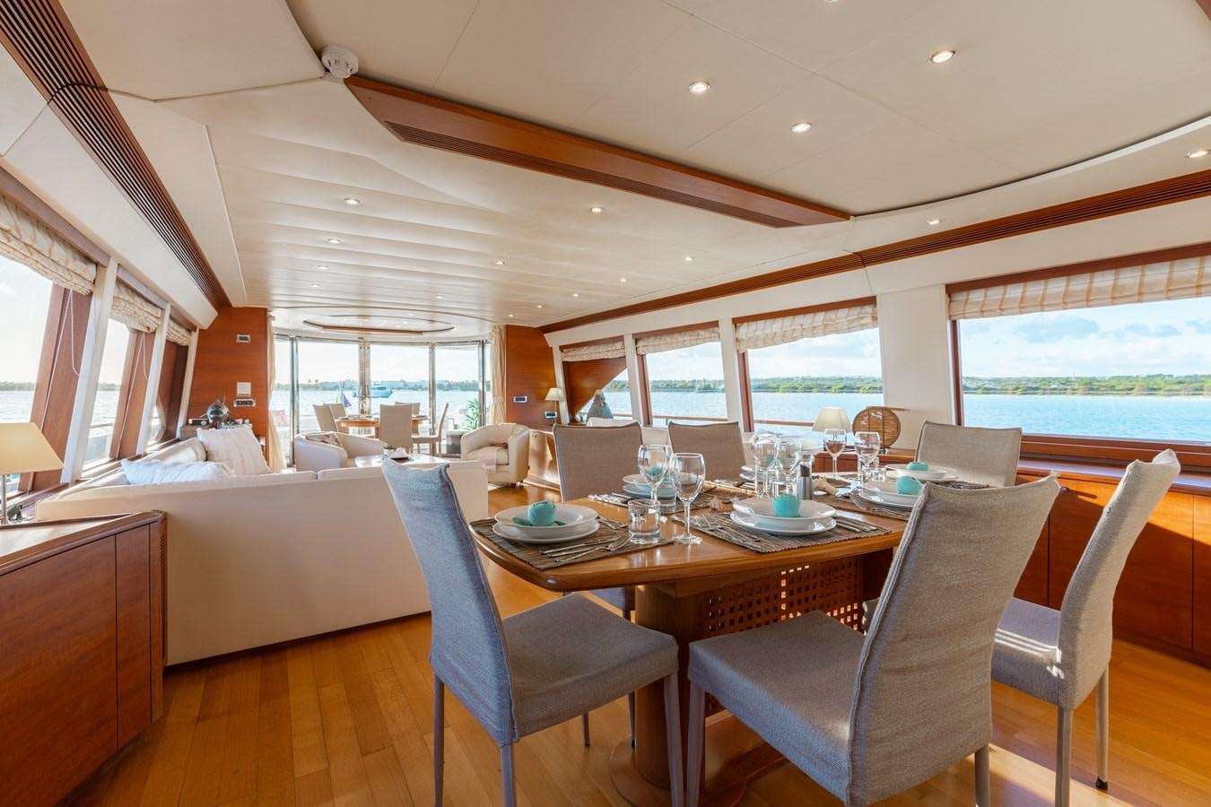 a large dining table with chairs aboard ECLIPSE Yacht for Sale