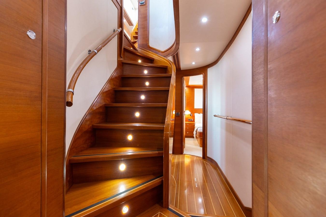 a wooden staircase in a house aboard ECLIPSE Yacht for Sale