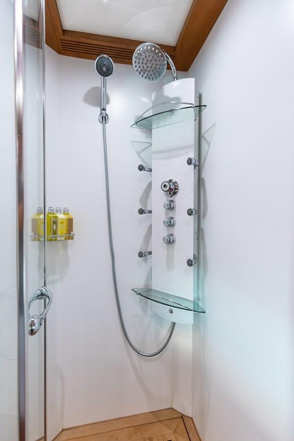 a shower with a glass door aboard ECLIPSE Yacht for Sale