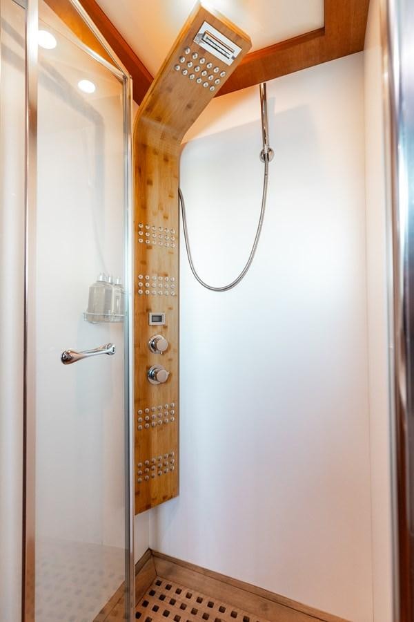 a shower with a wooden handle aboard ECLIPSE Yacht for Sale