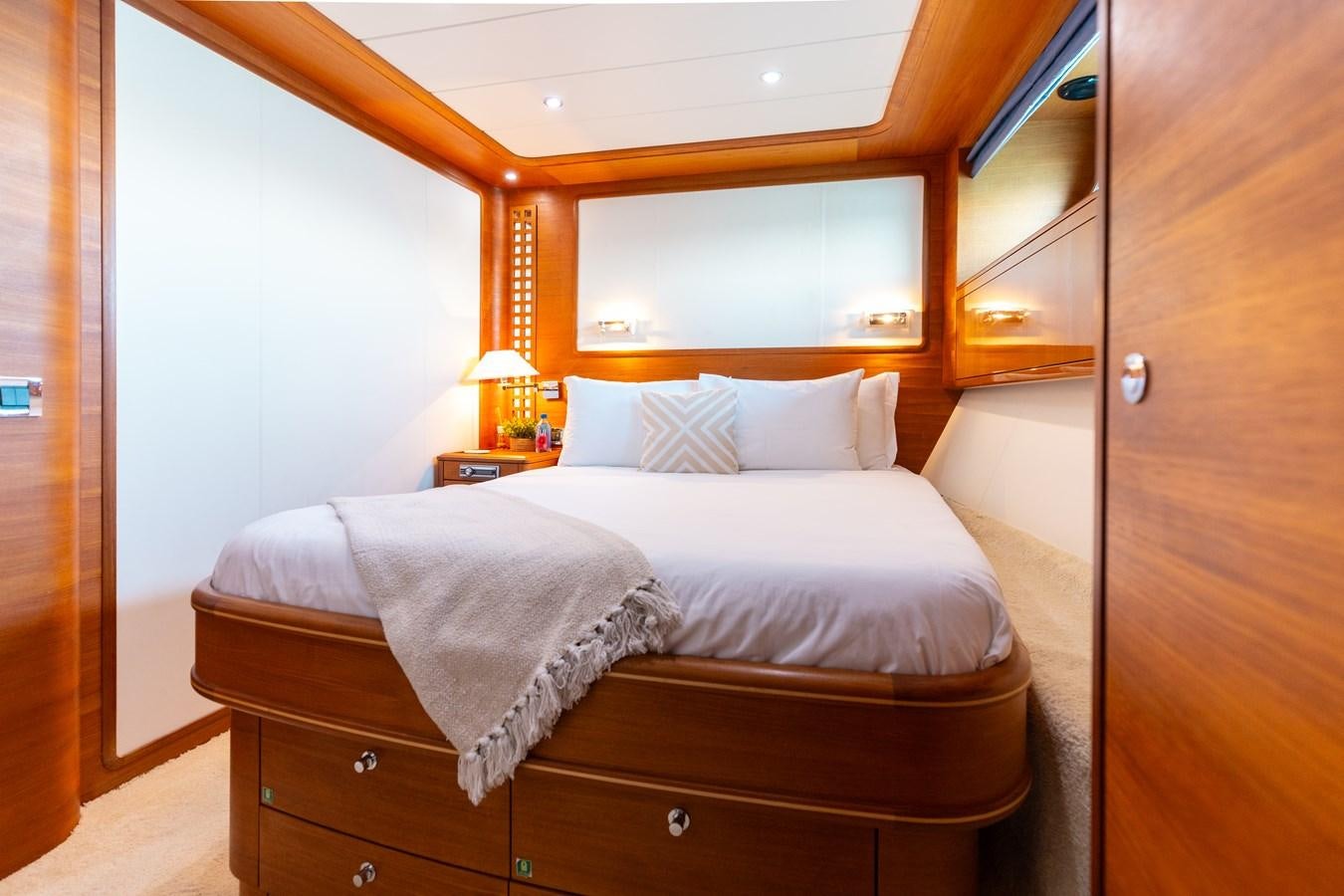 a bedroom with two beds aboard ECLIPSE Yacht for Sale