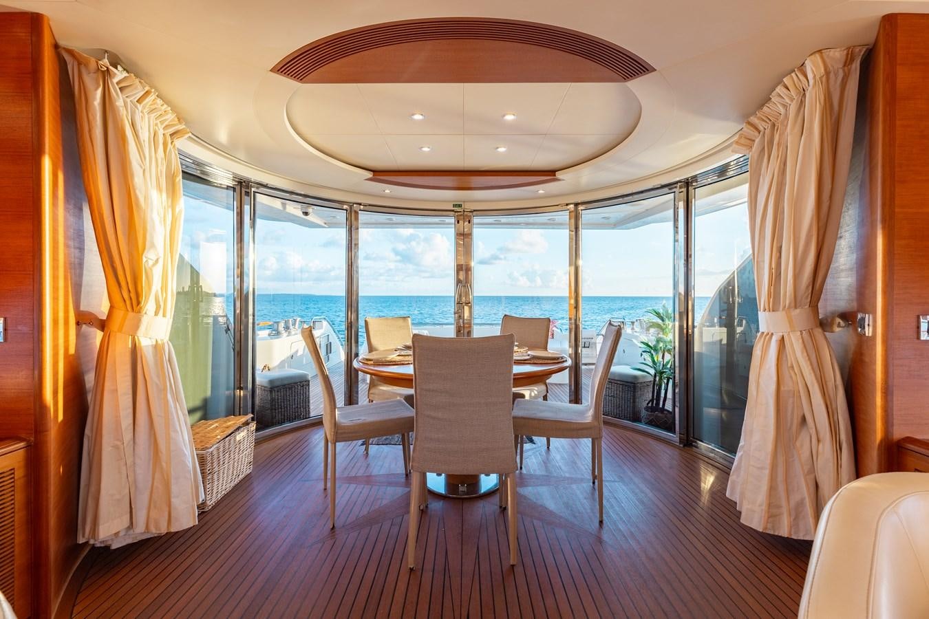 a dining table in a room aboard ECLIPSE Yacht for Sale