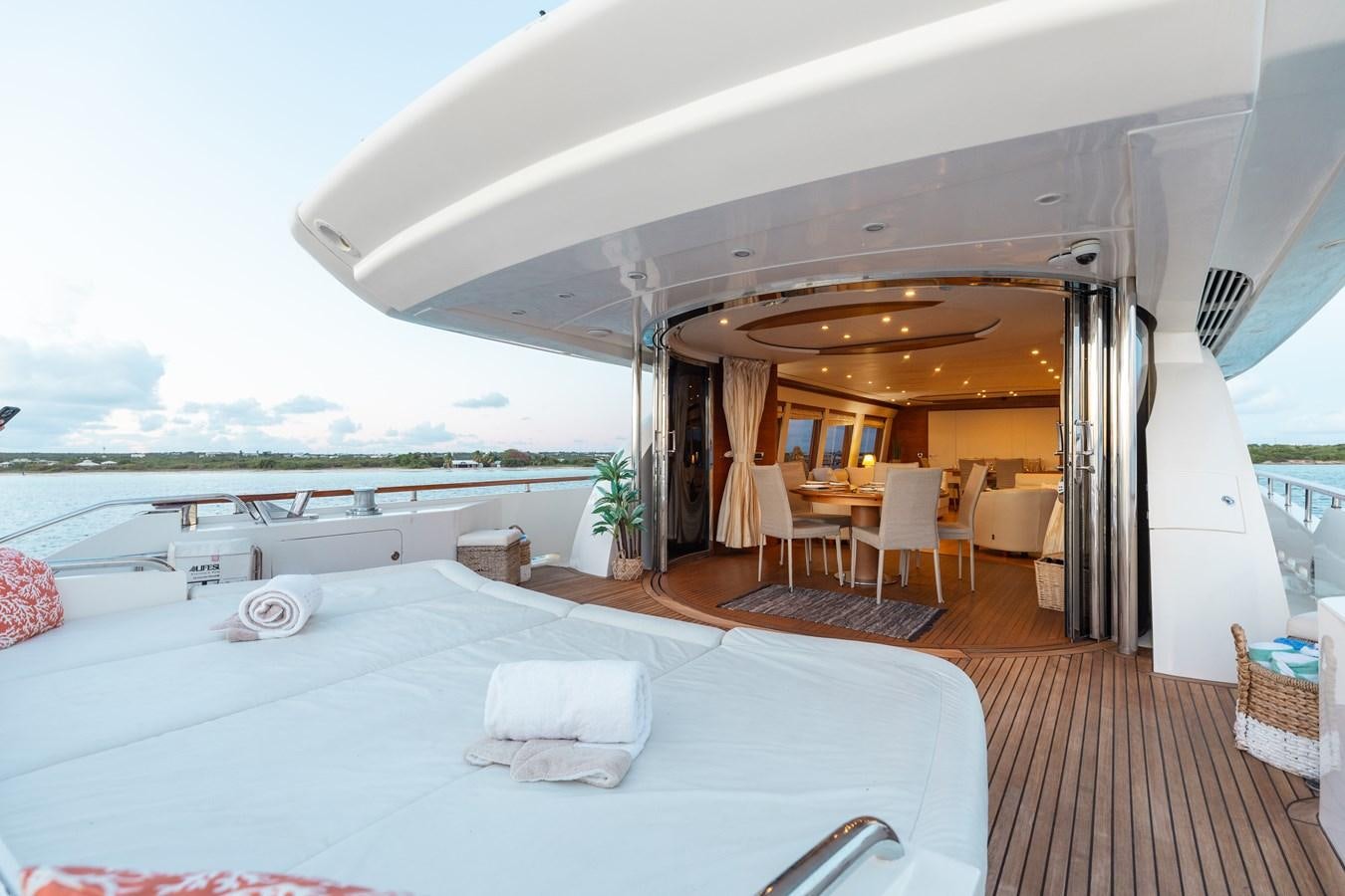 a room with a bed and a table and chairs aboard ECLIPSE Yacht for Sale
