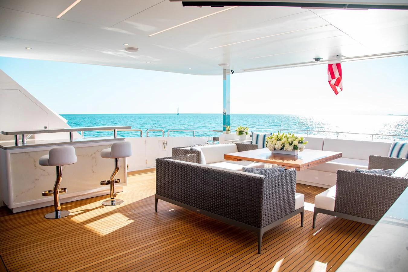 a room with a table chairs and a large body of water aboard CROWNED EAGLE Yacht for Sale