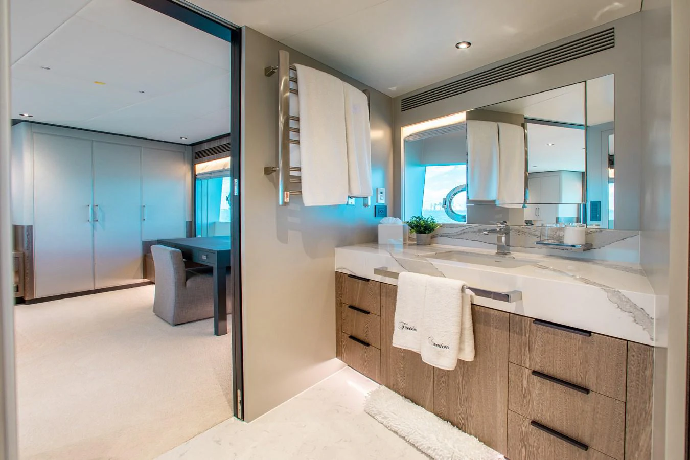 a bathroom with a sink and cabinets aboard CROWNED EAGLE Yacht for Sale