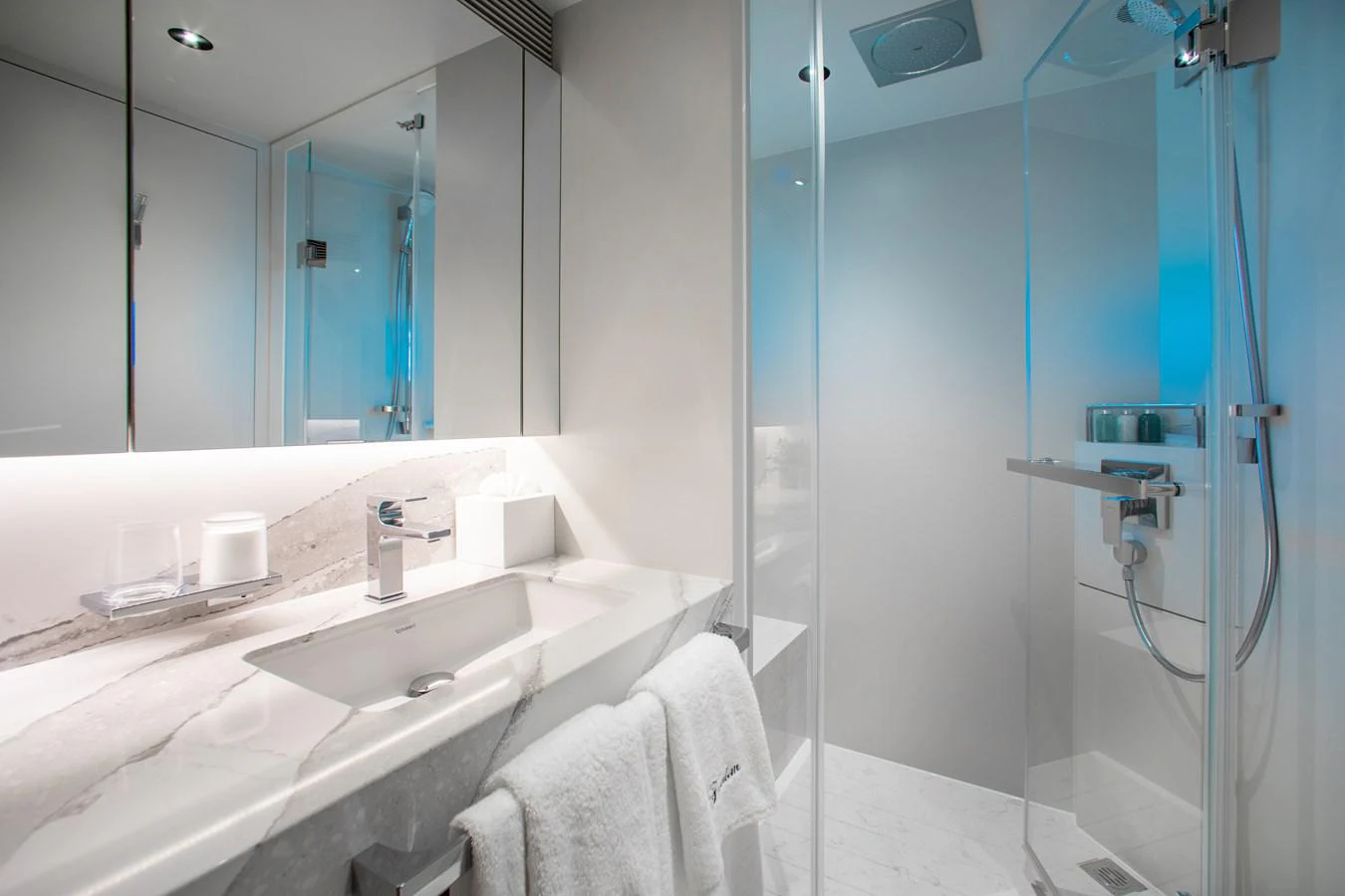 a bathroom with a large mirror aboard CROWNED EAGLE Yacht for Sale