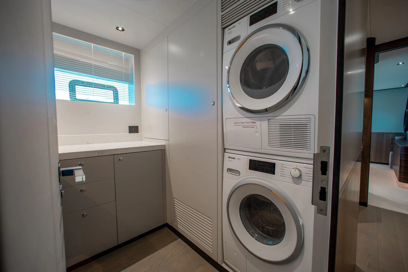 a washing machine in a room aboard CROWNED EAGLE Yacht for Sale